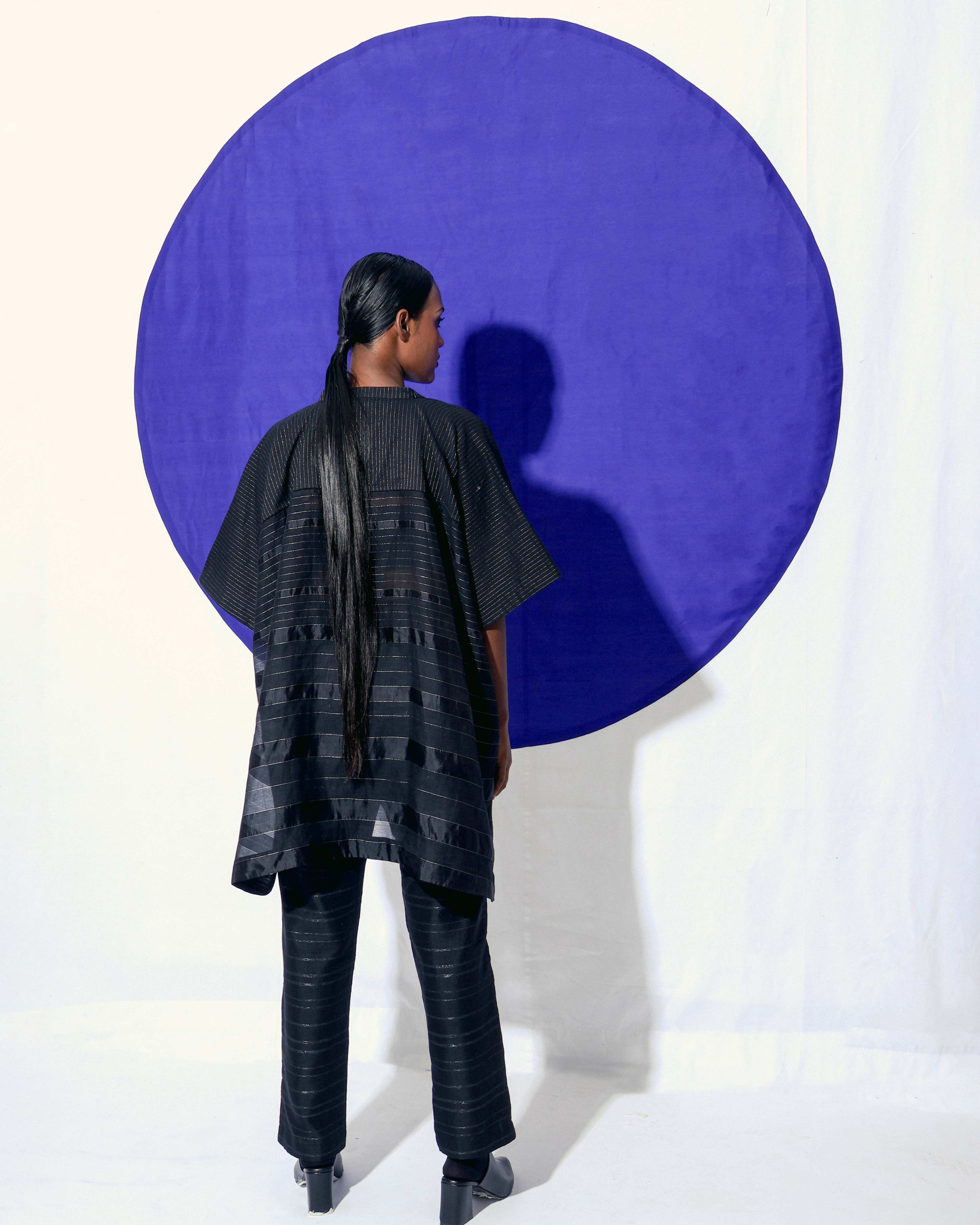 The Shoonyata Gradient Stripe Mandarin Top is crafted from handwoven silk using the traditional technique. It features a relaxed, boxy silhouette that drapes beautifully on the body