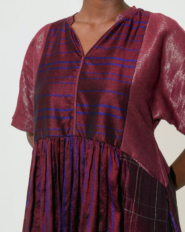 The Shoonyata Panelled Gathered Dress is handwoven from silk using the traditional Bengal weaving technique . It features a relaxed A-line silhouette.